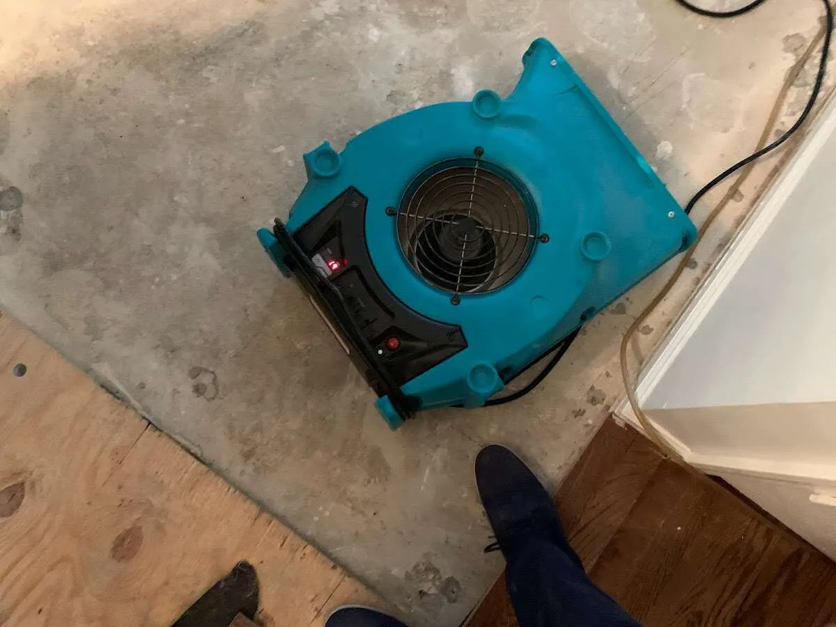 Air mover drying subfloor during Leak Detection & Repair in Deschutes River Woods